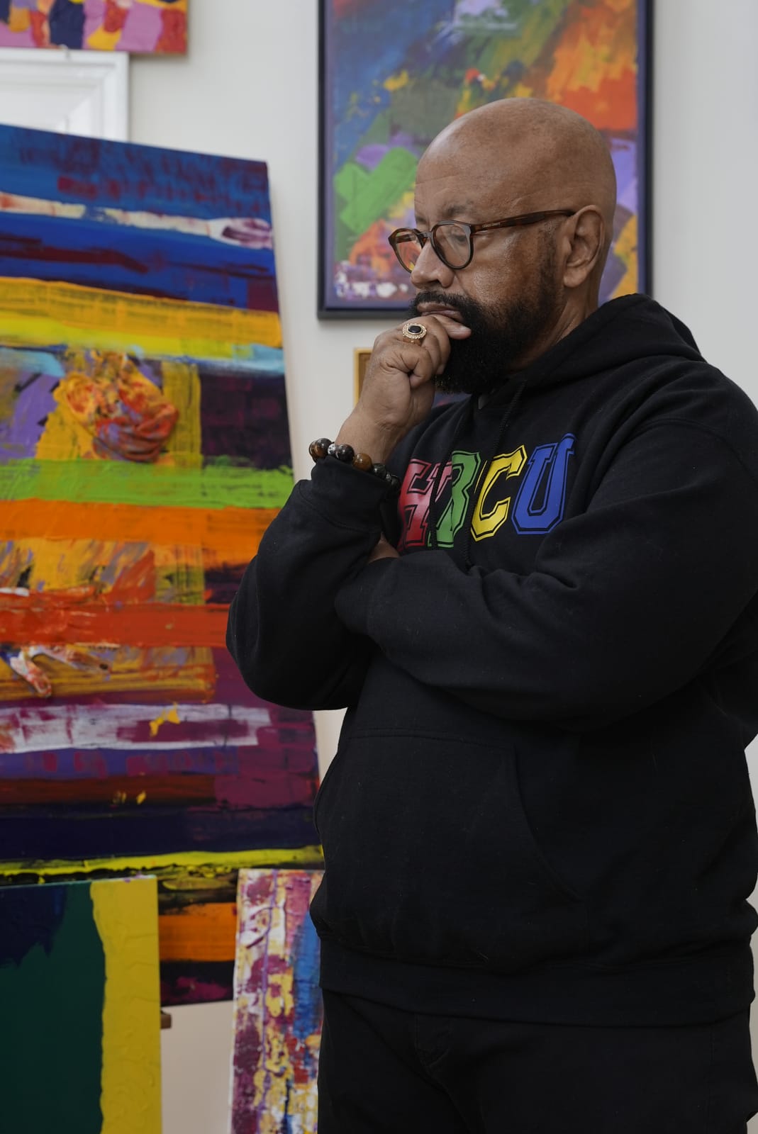 Bishop Hilliard in his studio, contemplating a painting